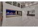 Open-concept living space with modern finishes and a view of the backyard pool through sliding glass doors at 2827 Richmar Ave, Henderson, NV 89074
