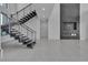 A view of the living room featuring a modern fireplace and staircase at 2827 Richmar Ave, Henderson, NV 89074