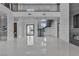 Expansive open-concept living area featuring sleek tile flooring, high ceilings and natural light at 2827 Richmar Ave, Henderson, NV 89074