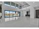 Modern living room boasting high ceilings, expansive windows, and seamless indoor-outdoor flow at 2827 Richmar Ave, Henderson, NV 89074