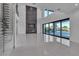 Modern living area featuring tile floors, a fireplace, and glass-enclosed wine rack, perfect for relaxing at 2827 Richmar Ave, Henderson, NV 89074