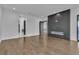 Open main bedroom area with fireplace and hardwood floors at 2827 Richmar Ave, Henderson, NV 89074