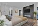 Beautiful main bedroom with fireplace, tv and hardwood floors at 2827 Richmar Ave, Henderson, NV 89074