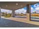 Covered patio area overlooking a pool and lush landscaping, perfect for outdoor living at 2827 Richmar Ave, Henderson, NV 89074