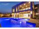 The backyard pool features a built-in spa and LED lighting, perfect for relaxing in the evening at 2827 Richmar Ave, Henderson, NV 89074