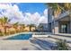 Inviting backyard pool and spa with modern home and lush landscaping at 2827 Richmar Ave, Henderson, NV 89074