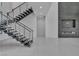 Sleek staircase with metal railings, leading to upper levels of the modern home at 2827 Richmar Ave, Henderson, NV 89074