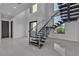 Modern staircase with metal railing and view of the outside at 2827 Richmar Ave, Henderson, NV 89074