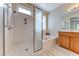 Bright bathroom with a walk-in shower, soaking tub, and vanity at 3032 Stratmoor Hills Ave, Henderson, NV 89052
