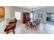 Lovely dining area with tile flooring, a large hutch, and views of the outdoor patio at 3032 Stratmoor Hills Ave, Henderson, NV 89052