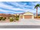Beautiful home featuring well-maintained landscaping, a red tile roof, and a two-car garage at 3032 Stratmoor Hills Ave, Henderson, NV 89052