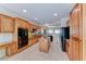 Bright kitchen with granite countertops, wooden cabinets, stainless appliances, and an island at 3032 Stratmoor Hills Ave, Henderson, NV 89052