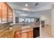 Open kitchen with granite countertops, cabinets, and a sink at 3032 Stratmoor Hills Ave, Henderson, NV 89052