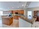 Spacious kitchen features an island, breakfast bar, granite countertops, and stainless appliances at 3032 Stratmoor Hills Ave, Henderson, NV 89052