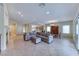 Spacious living room with tile flooring, an open layout, and plenty of natural light at 3032 Stratmoor Hills Ave, Henderson, NV 89052