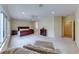 Expansive main bedroom featuring a sitting area, ensuite bath, and large windows at 3032 Stratmoor Hills Ave, Henderson, NV 89052