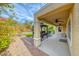 Covered patio with ceiling fans and a grilling area, perfect for outdoor entertaining at 3032 Stratmoor Hills Ave, Henderson, NV 89052