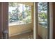 Relaxing balcony view overlooking mature trees, landscaping, and the surrounding neighborhood at 3145 E Flamingo Rd # 2119, Las Vegas, NV 89121