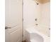 Close-up of white bath tub with shower head and tile surround at 3145 E Flamingo Rd # 2119, Las Vegas, NV 89121
