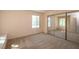 Carpeted bedroom with bright window and closet with mirror doors at 3145 E Flamingo Rd # 2119, Las Vegas, NV 89121