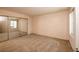 Spacious bedroom featuring plush carpet and large mirrored closet at 3145 E Flamingo Rd # 2119, Las Vegas, NV 89121