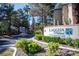 Well-maintained community entrance with lush landscaping and clear signage for Laguna Palms Condominiums at 3145 E Flamingo Rd # 2119, Las Vegas, NV 89121