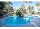 Beautiful community pool with island palm trees, inviting you to relax and enjoy the scenery at 3145 E Flamingo Rd # 2119, Las Vegas, NV 89121