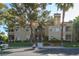 Building exterior view featuring well-maintained landscaping and parking at 3145 E Flamingo Rd # 2119, Las Vegas, NV 89121