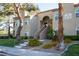 Inviting two-story condo with desert landscaping, a walkway to unit entrances, and ample natural light from large windows at 3145 E Flamingo Rd # 2119, Las Vegas, NV 89121
