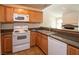 Well-appointed kitchen area with a breakfast bar, modern appliances, and tile flooring at 3145 E Flamingo Rd # 2119, Las Vegas, NV 89121