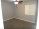 Bright bedroom with a large window, neutral carpet, and a ceiling fan that offers comfort and style at 3507 Pointe Vedra Ct, Las Vegas, NV 89122