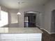 Spacious kitchen with granite countertops island and a seamless view into living areas of the home at 3507 Pointe Vedra Ct, Las Vegas, NV 89122