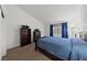 Cozy bedroom featuring a large bed, bookshelf, dresser, and natural light, creating a peaceful space at 3561 Yorba Linda Dr, Las Vegas, NV 89122