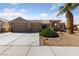 Charming single-story home with a three car garage, desert landscaping, and a well manicured lawn at 3561 Yorba Linda Dr, Las Vegas, NV 89122