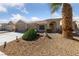 Attractive single-story home with mature landscaping and a three-car garage on a sunny day at 3561 Yorba Linda Dr, Las Vegas, NV 89122