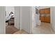 A hallway with tile flooring leading to a bathroom and bedroom at 3561 Yorba Linda Dr, Las Vegas, NV 89122