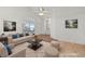 Stylishly staged living room featuring neutral colors, modern furniture, and plenty of natural light at 3561 Yorba Linda Dr, Las Vegas, NV 89122