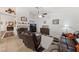 Cozy living room featuring tile floors, a fireplace, and comfortable leather seating arrangement at 3561 Yorba Linda Dr, Las Vegas, NV 89122