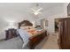 Comfortable main bedroom featuring a spacious layout with a large bed, ceiling fan, and natural light at 3561 Yorba Linda Dr, Las Vegas, NV 89122