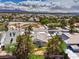 Aerial view showcasing beautiful neighborhood with mature trees and green spaces at 3710 E Oquendo Rd, Las Vegas, NV 89120