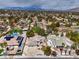 Aerial view of home with pool, solar panels, driveway, and landscaping at 3710 E Oquendo Rd, Las Vegas, NV 89120