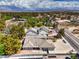 Expansive aerial view of a home with a tile roof, lush greenery, and scenic mountain views in the distance at 3710 E Oquendo Rd, Las Vegas, NV 89120