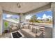Relaxing outdoor balcony with comfortable seating, a fire pit, and scenic neighborhood views at 3710 E Oquendo Rd, Las Vegas, NV 89120