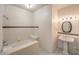 Cozy bathroom with a shower-tub combo and a white pedestal sink at 3710 E Oquendo Rd, Las Vegas, NV 89120