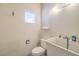 Small bathroom featuring a toilet, utility sink, and a small window at 3710 E Oquendo Rd, Las Vegas, NV 89120