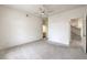 Bedroom with a ceiling fan, view to a stairway and a sink in an adjoined room at 3710 E Oquendo Rd, Las Vegas, NV 89120