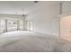 Bright bedroom with vaulted ceiling, ceiling fan, bay windows, and sliding door to backyard at 3710 E Oquendo Rd, Las Vegas, NV 89120