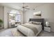 Serene bedroom with modern furniture, a large window, and plenty of natural light at 3710 E Oquendo Rd, Las Vegas, NV 89120