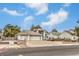 A two-story home with a three-car garage and a well-manicured front yard at 3710 E Oquendo Rd, Las Vegas, NV 89120