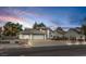 Charming single-Gathering home featuring a spacious driveway, two-car garage and manicured landscaping at 3710 E Oquendo Rd, Las Vegas, NV 89120